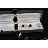 A 9ct gold onyx set bracelet, 19cm long together with a pair of matching earrings, approximately 26.