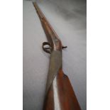 A 19th century percussion single barrel shotgun, with walnut stock and chequered grip,