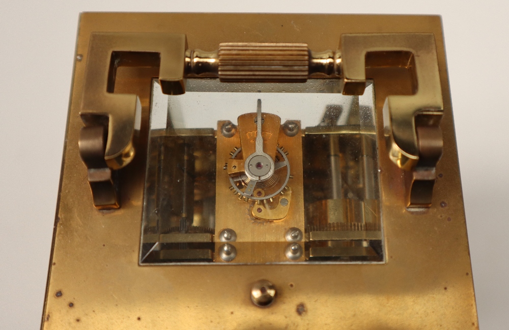 A 20th century brass cased carriage clock, with a circular dial with Roman numerals and alarm dial, - Image 6 of 7