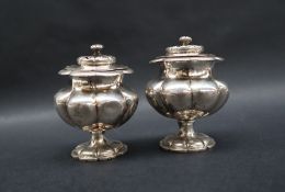 A pair of Victorian silver pounce / pepper pots,