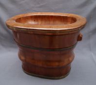 A Chinese wooden baby bath having removable interior,