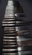 A large collection of silver handled Kings pattern table knives,