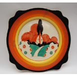 A Clarice Cliff sandwich plate decorated in the Farmhouse pattern with an orange roofed farmhouse