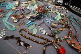 Assorted costume jewellery including rings, brooches, bangles, necklaces,