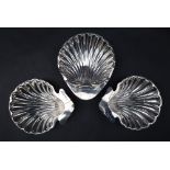 A pair of Edward VII silver shell dishes, Birmingham, 1906, together with another silver shell dish,