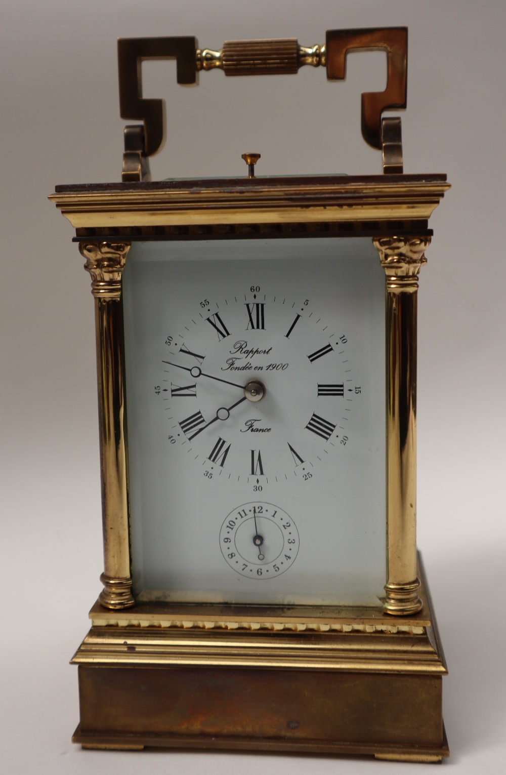 A 20th century brass cased carriage clock, with a circular dial with Roman numerals and alarm dial, - Image 2 of 7