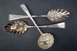 A pair of George IV silver berry spoons, the bowls embossed with fruit and leaves, London, 1822,