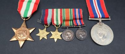 A World War II British War medal together with an Italy Star and a set of four World War II