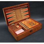 An early 20th century mahogany cased games compendium, with steeple chase board,