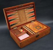 An early 20th century mahogany cased games compendium, with steeple chase board,