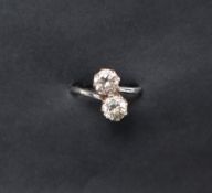 An 18ct gold two stone diamond ring,