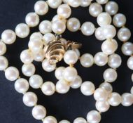 A pearl necklace set with sixty-five regular pearls each approximately 6mm in diameter to an 18ct