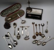 A late Victorian silver sifting spoon, London, 1890 together with a collection of silver tea spoons,