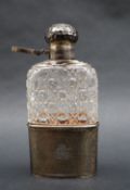 An Edward VII silver and hobnail cut glass hip flask, with removable beaker base,