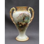A Royal Worcester twin handled pot pourri vase of inverted baluster form with a pierced flared rim