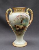 A Royal Worcester twin handled pot pourri vase of inverted baluster form with a pierced flared rim