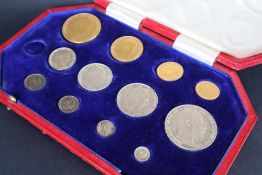 A partial Edward VII 1902 specimen coin set comprising a gold five pounds coin,