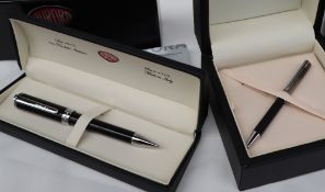 An Aurora silver ball point pen boxed together with another Aurora ballpoint pen,