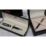 An Aurora silver ball point pen boxed together with another Aurora ballpoint pen,