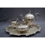 A Continental 800 standard silver three piece tea set of globular form decorated with scrolling