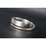 A Georg Jensen silver bangle by Hans Hansen, marked with trademark, signature and 925S Danmark,