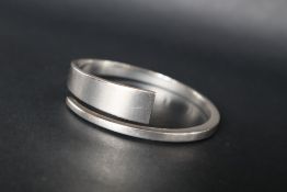 A Georg Jensen silver bangle by Hans Hansen, marked with trademark, signature and 925S Danmark,