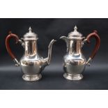 A George V silver coffee pot of baluster form on a spreading foot,