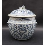 A Chinese porcelain pot and cover, the domed lid with lion dog finial,