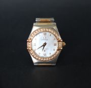 A lady's Omega Constellation wristwatch with a mother of pearl dial,