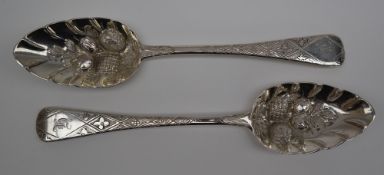 A pair of George IV silver berry spoons, the bowls embossed with fruit and leaves, London, 1822, WS,