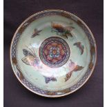 A Wedgwood lustre fruit bowl decorated with butterflies highlighted in gilt against a mottled