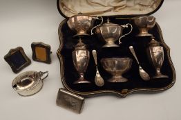 A George VI silver six piece cruet set comprising two mustard pots, two salts and two pepperettes,