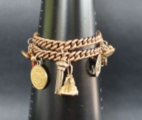 A 9ct gold bracelet with individually hallmarked twisted links set with numerous charms including a