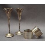 A pair of late Victorian silver bud vases with a flared top and tapering twisted column,