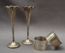 A pair of late Victorian silver bud vases with a flared top and tapering twisted column,