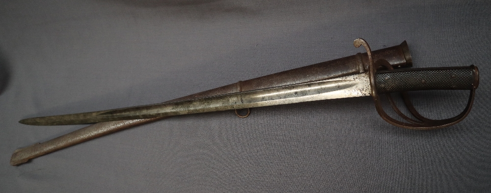 A Victorian Sword, the 87cm single edge fullered steel blade double edged for the last 26cm,