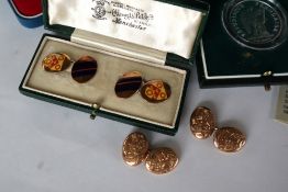 A pair of 9ct gold cufflinks with enamel coat of arms decoration,