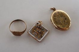 A yellow metal child's signet ring together with a yellow metal white enamel and seed pearl letter