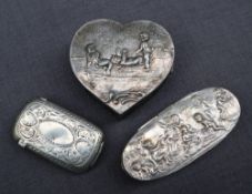 A continental silver heart shaped box decorated with cherubs together with an oval trinket box and