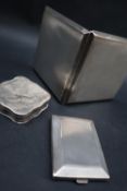 A George V silver cigarette case of square form, with engine turned decoration, London, 1939,