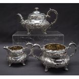 A Victorian silver three piece tea service comprising a teapot,