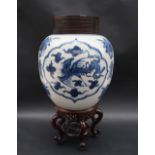 A Chinese porcelain ginger jar, decorated with phoenix amongst clouds in arched vignettes,