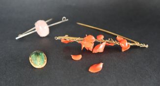 A coral and yellow metal bar brooch together with a rose quartz bar brooch and a beetle stick pin