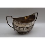 A George V silver twin handled sugar basin, with a half gadrooned body, Sheffield, 1924,