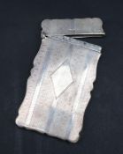 A George V silver card carrying case of rectangular shape, with line and engine turned decoration,