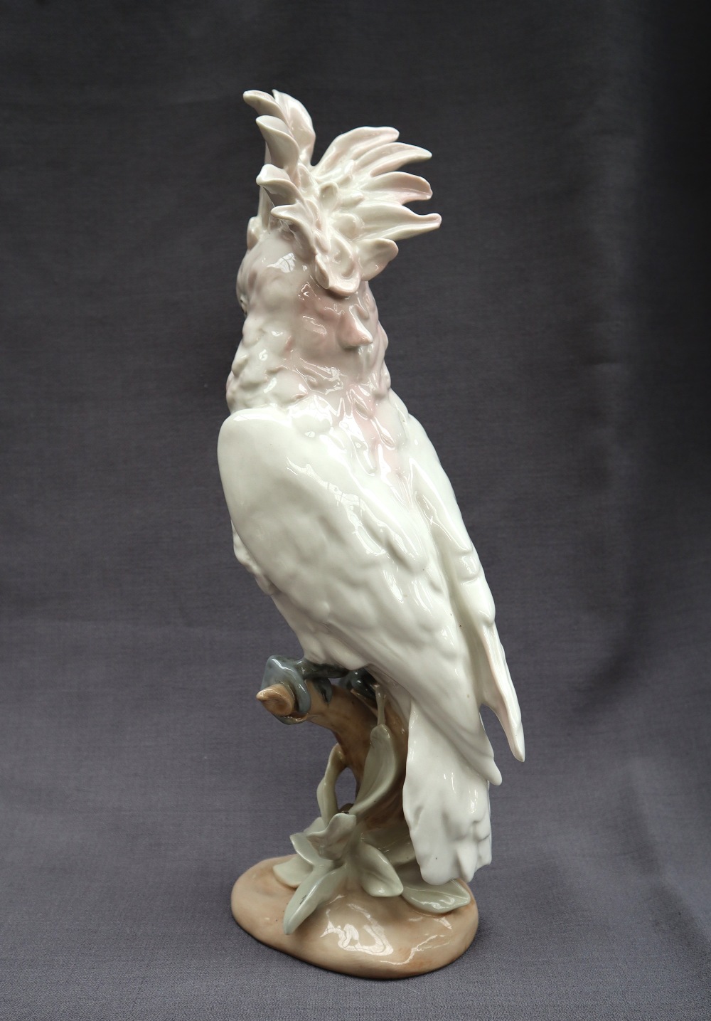 A Royal Dux porcelain figure of a cockatoo perched on a branch with leaves and an oval base, - Image 3 of 5