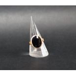 A 9ct yellow gold signet ring with an oval onyx panel, size L 1/2, approximately 4.