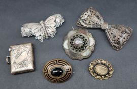 A Momento brooch of scrolling form with hair to the central panel together with a banded agate and