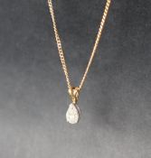 A diamond pendant of pear shape, 7mm x 5mm on an 18ct gold chain, overall approximately 4.