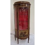 A continental vitrine of D shape with gilt metal mounts, domed glass door and side panels,